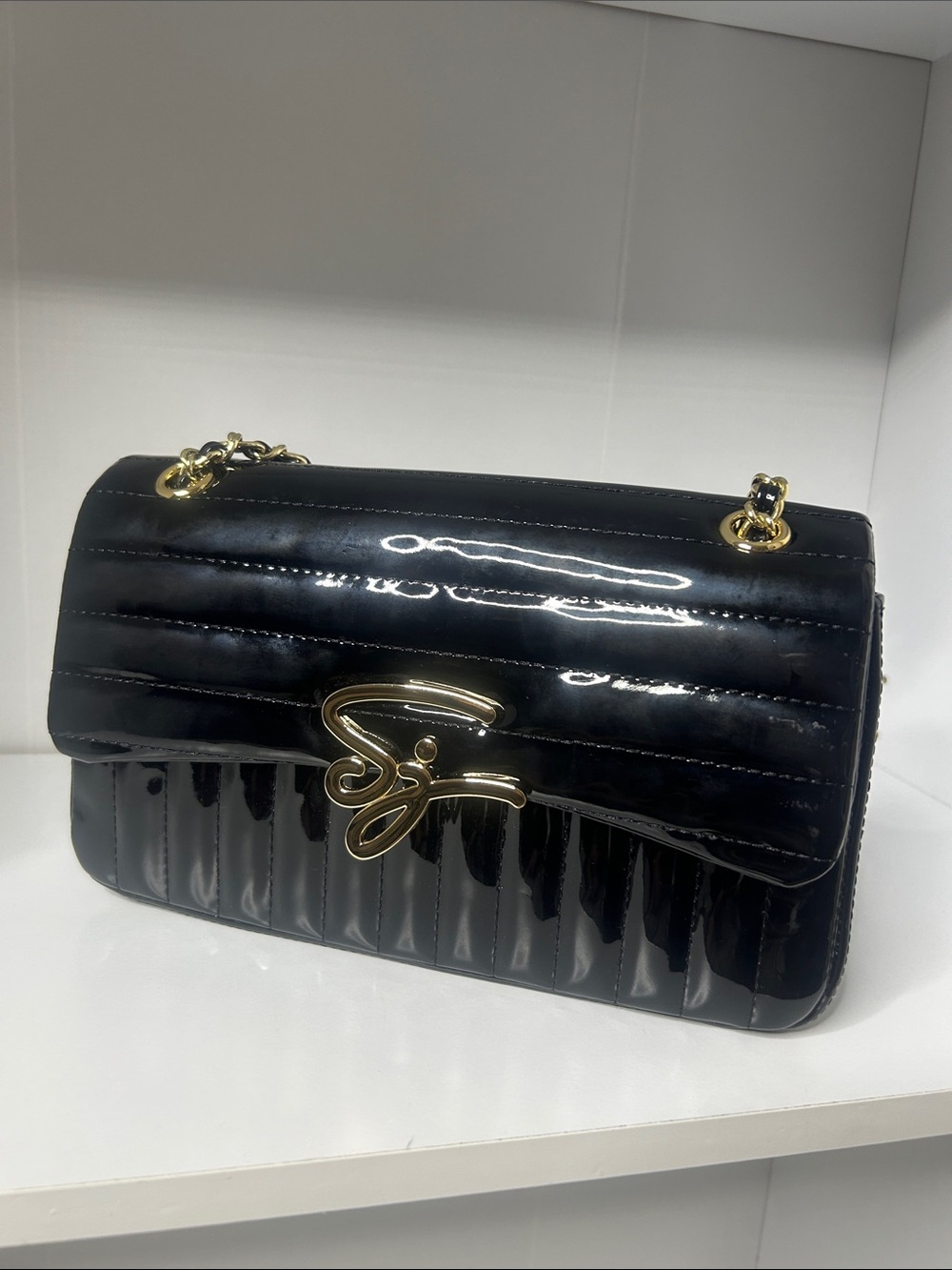 Patent Quilted Black Shoulder Bag with Gold Script Accent